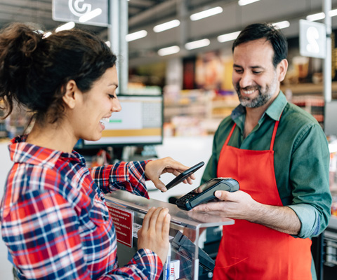 retail worker and woman shopper